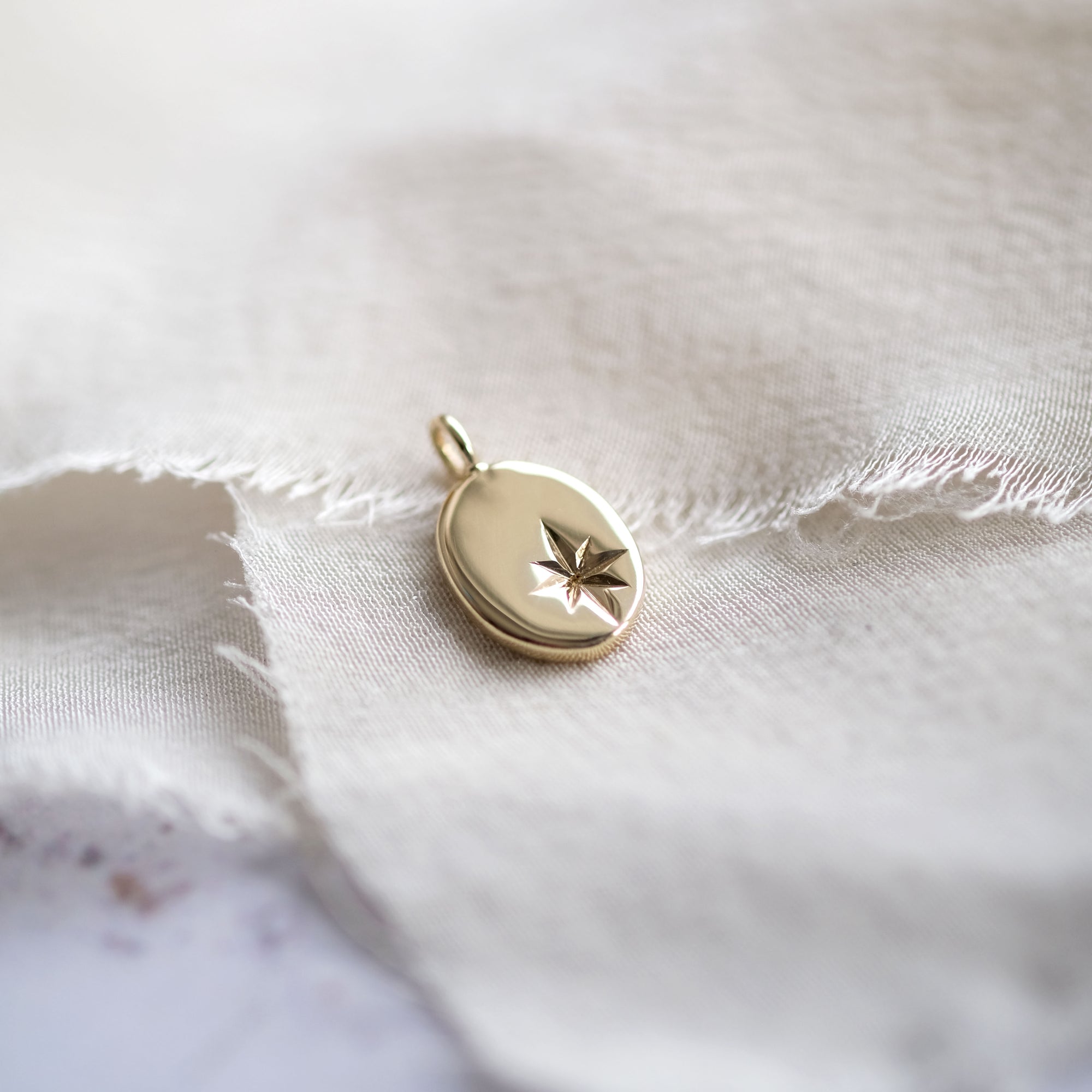 Star Engraved Oval Pendant in Solid Gold