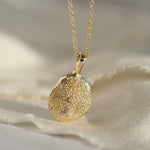 Gold dog paw print necklace
