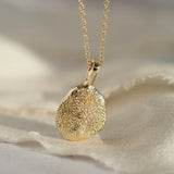 Gold dog paw print necklace