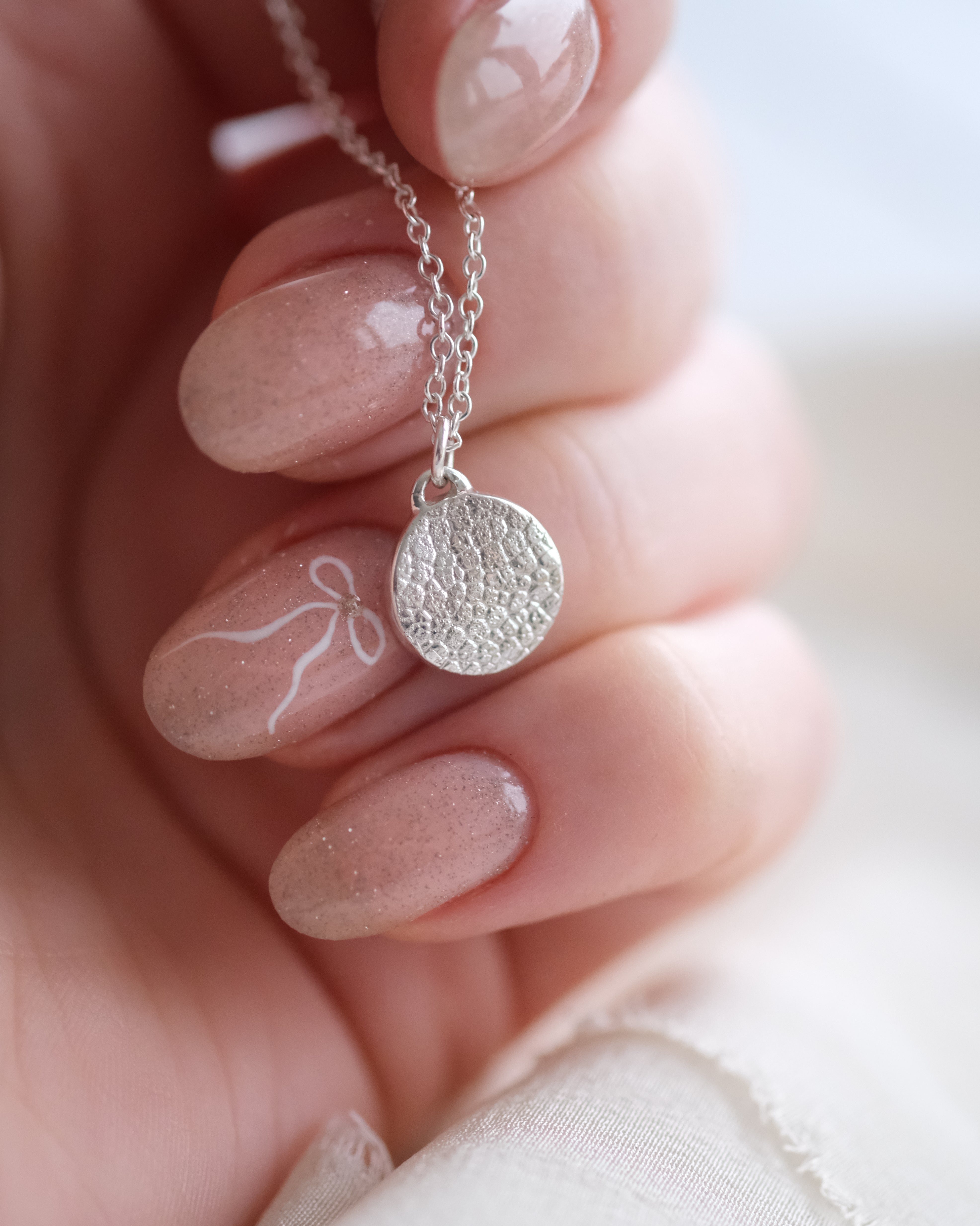 Silver dog nose print necklace