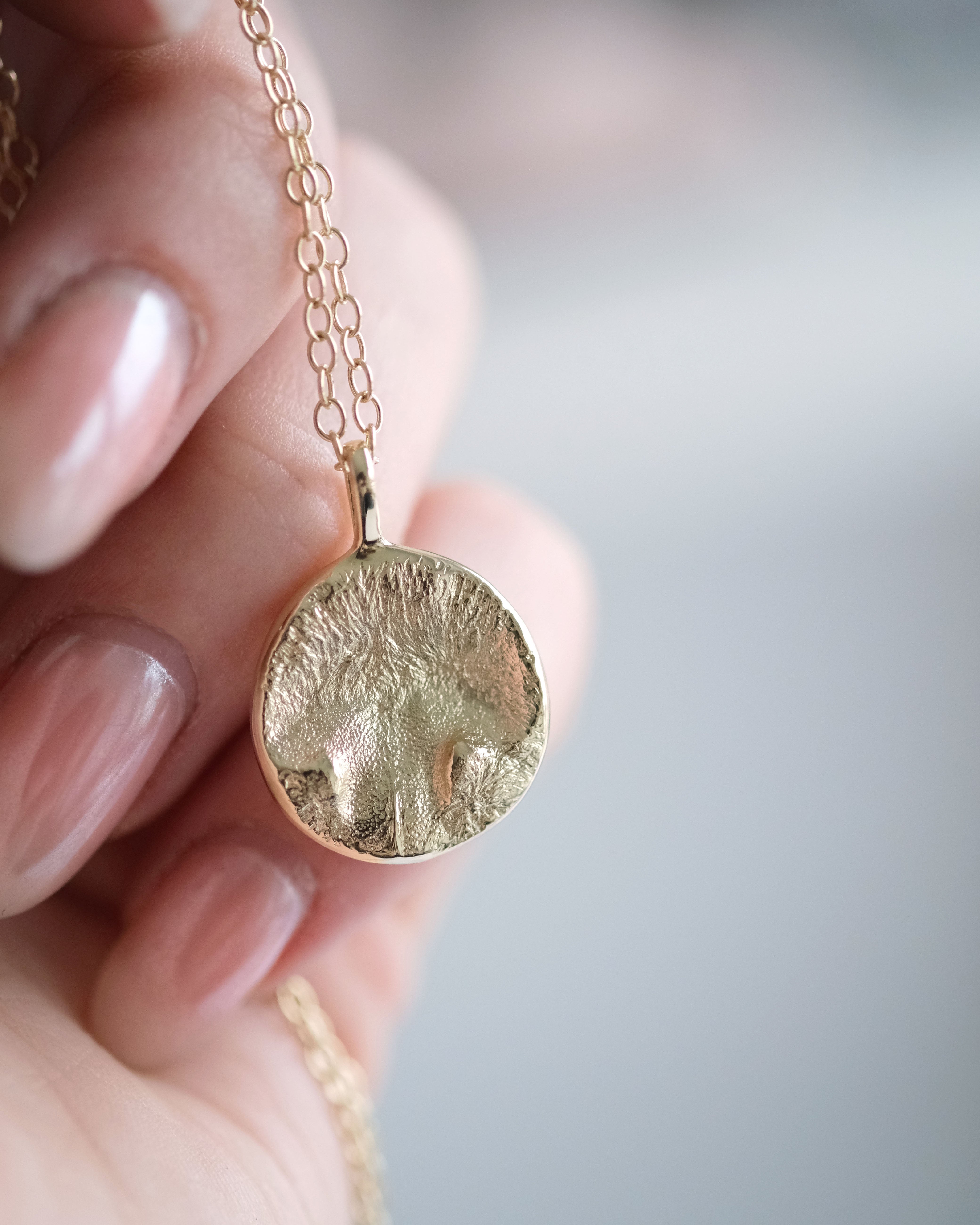 Gold cat nose print necklace