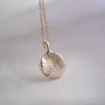 Gold dog nose print necklace