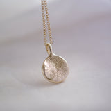 Gold dog nose print necklace