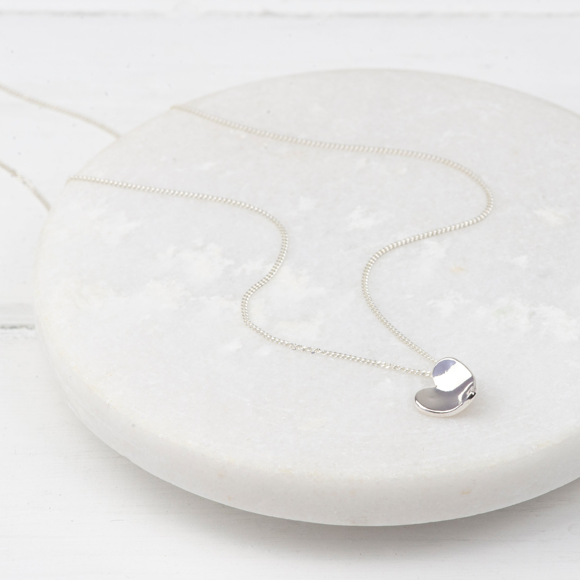 Silver heart pendant on a curb chain